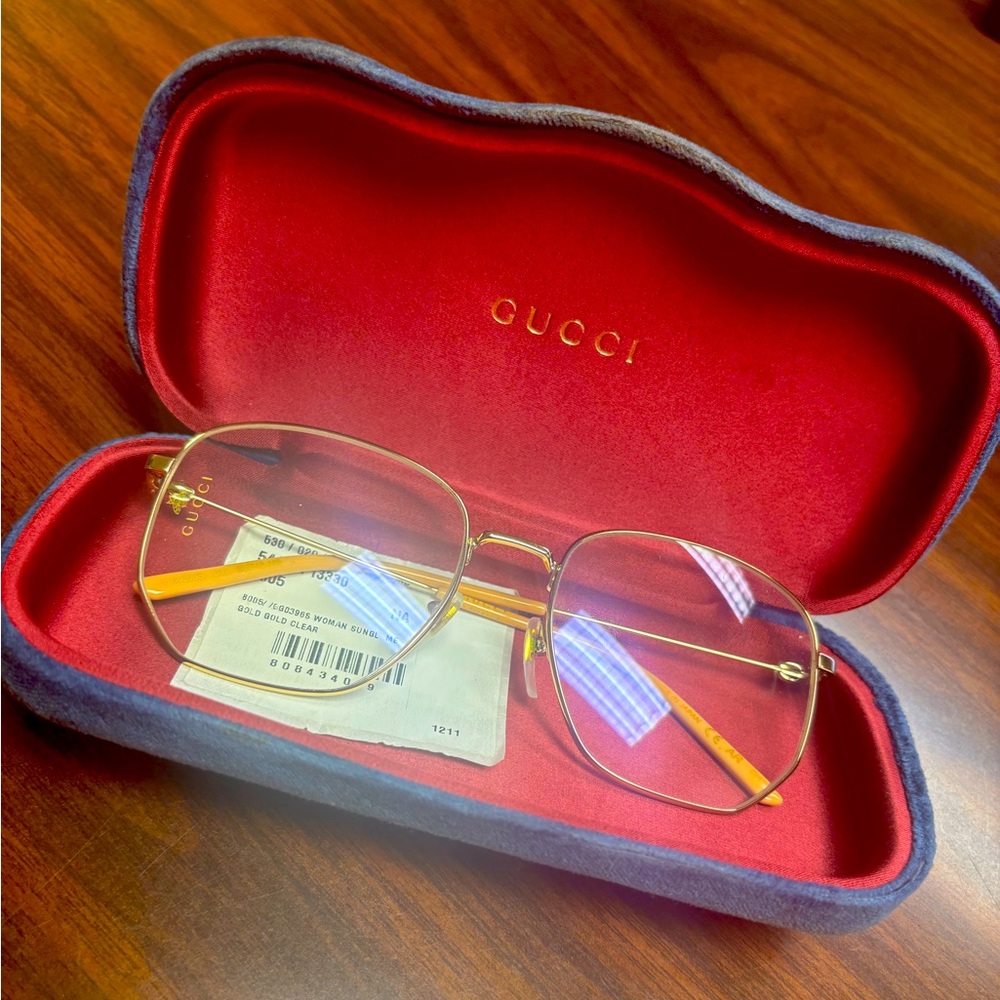 preowned Women's gold Gucci square framed glasses in great condition. 56-18-140